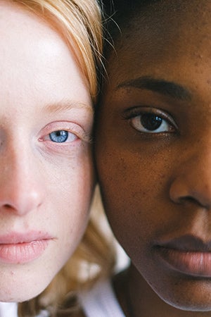 Two women's faces close up