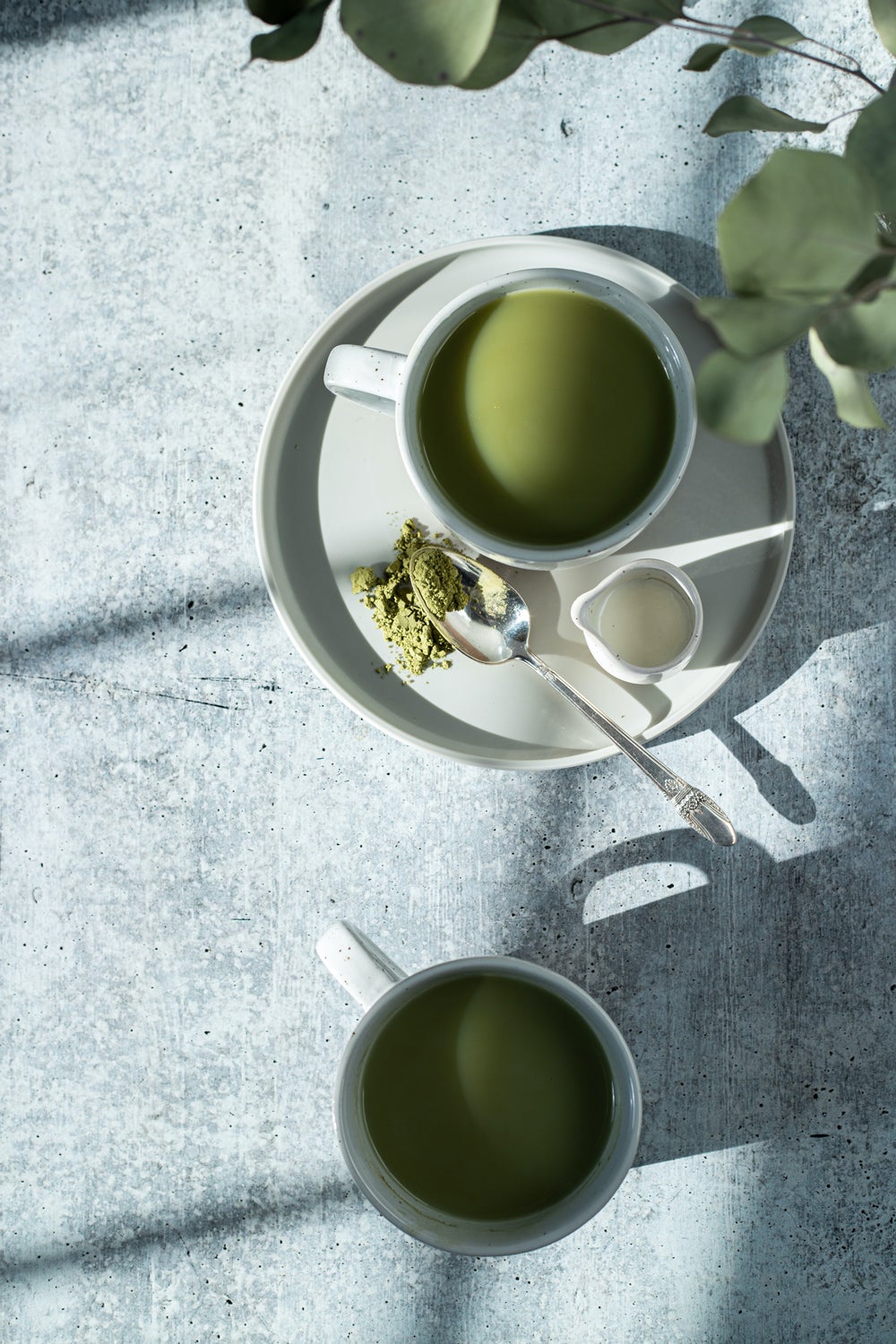 two cups of matcha green tea