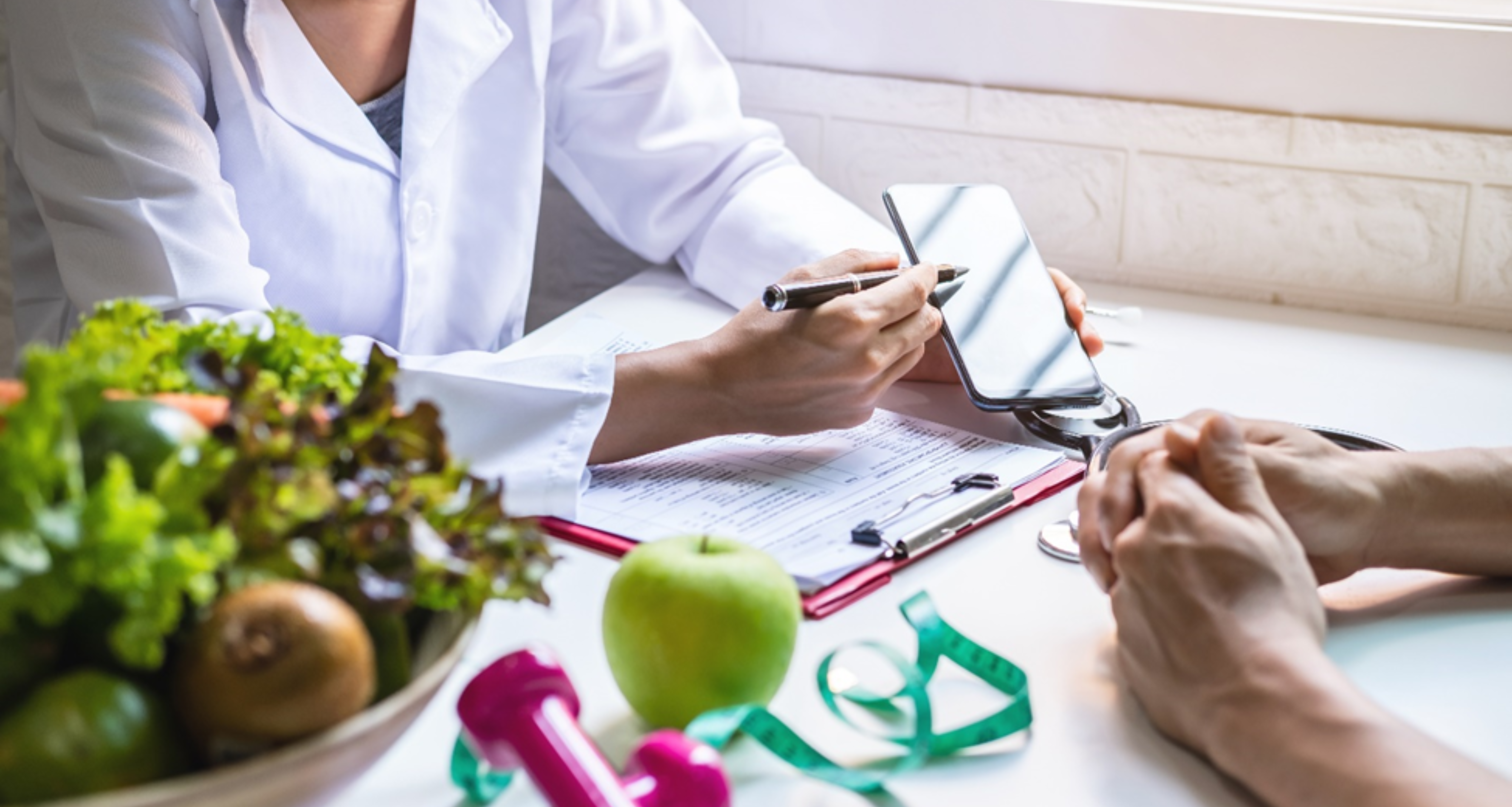 Doctor showing phone to a patient.