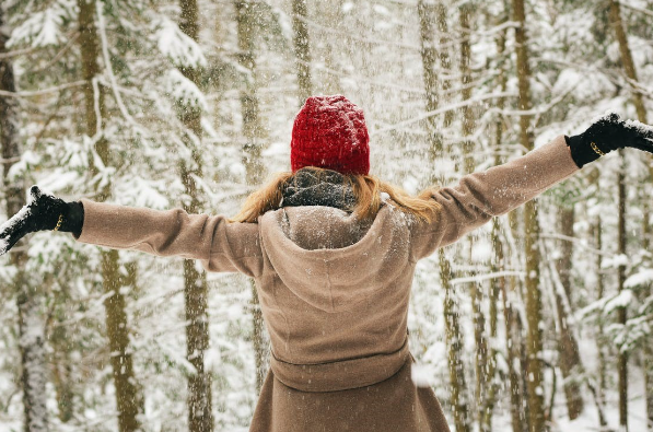 Women playing in snow outside